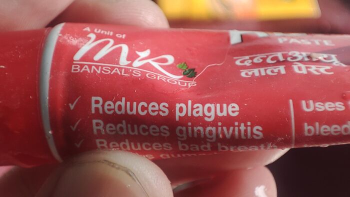 Toothpaste package with a funny spelling fail stating it reduces plague