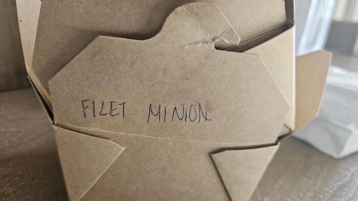 Cardboard takeout box labeled Filet Minion as a hilarious spelling fail