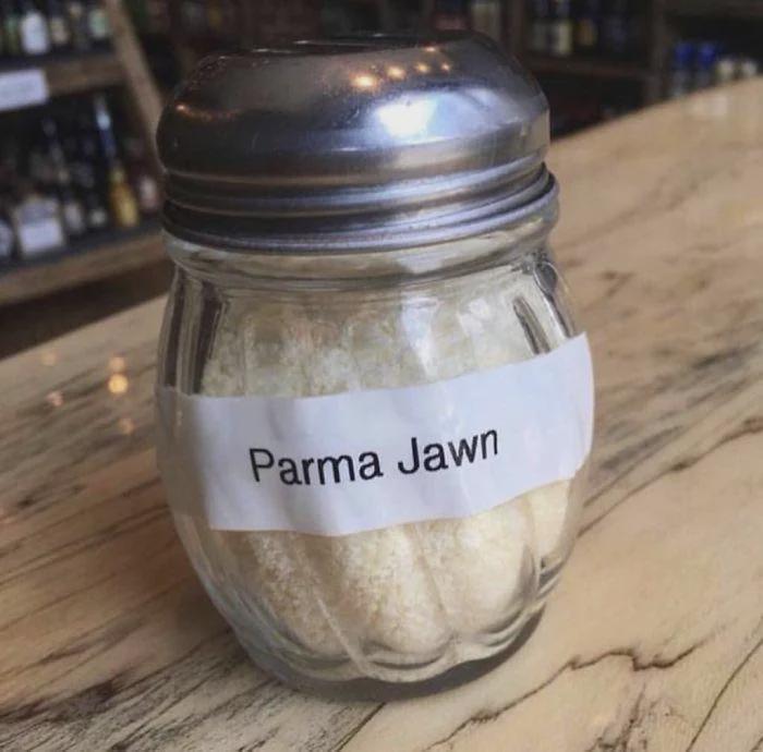 Glass shaker label with spelling fails reading Parma Jawn for parmesan cheese.