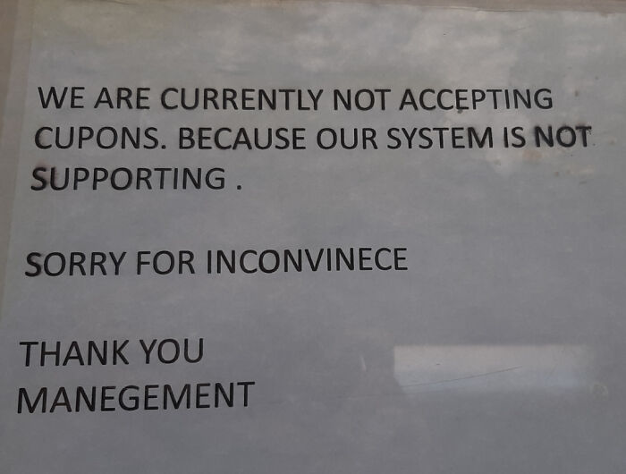 Notice with spelling fails including cupons and manegement on a window
