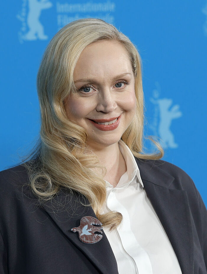 Actress Gwendoline Christie smiling at a red carpet event.