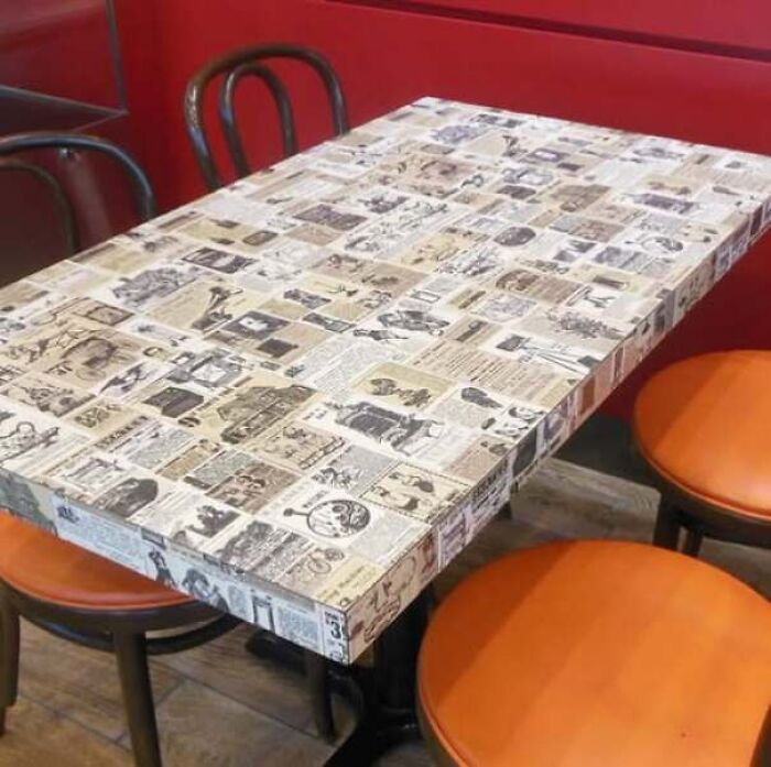 Retro diner table decorated with old newsprint collages in old photos of America.