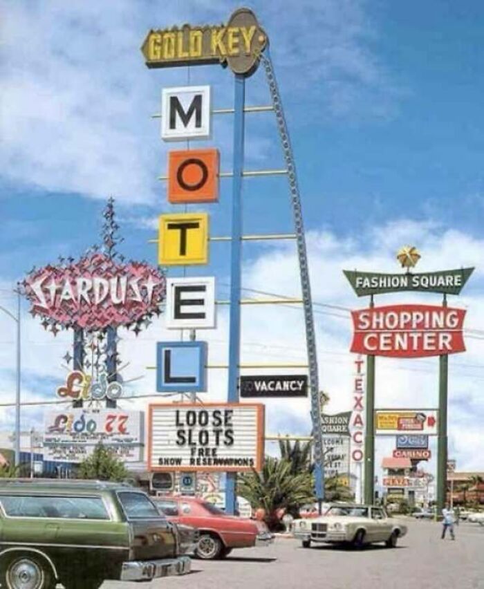 Vintage neon signs along a highway strip in one of the old photos of America.