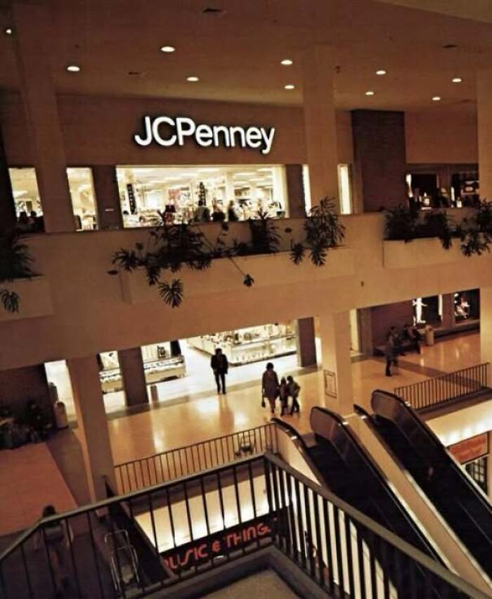 Interior view of a vintage multi-level shopping mall featuring a JCPenney store from old photos of America.