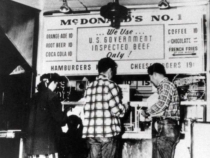 Old photo of early McDonalds fast food restaurant menu and counter in America