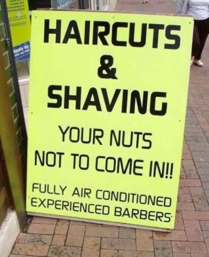 A poorly worded barbershop sign that accidentally sounds inappropriate, showing people confidently wrong.