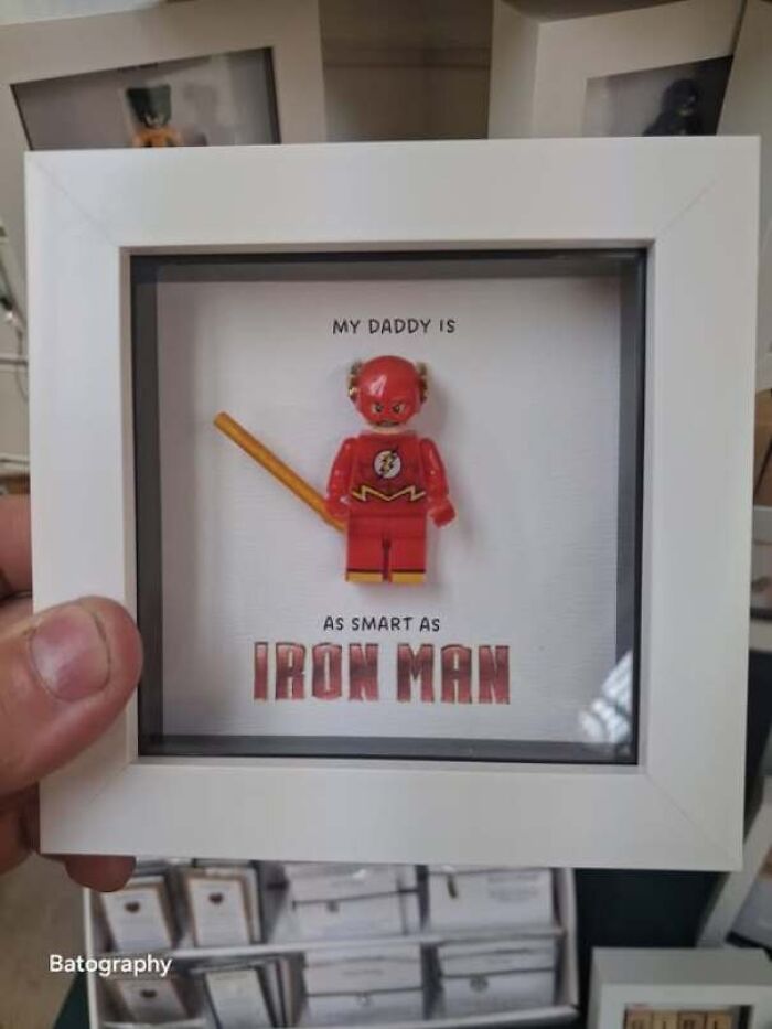 Framed picture featuring a Lego Flash figure labeled as Iron Man, an amusing moment of someone being confidently wrong.