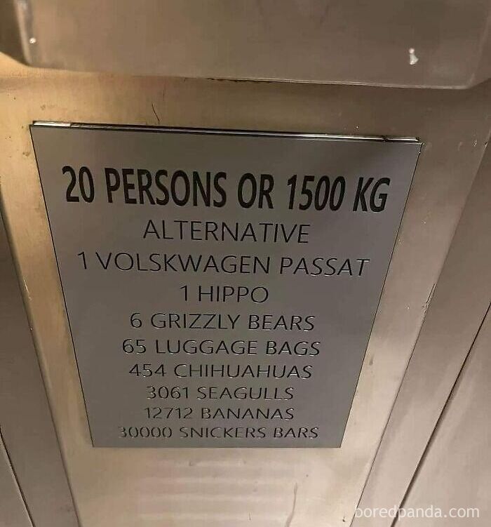 An elevator plaque listing absurd weight limits like 1 hippo or 30000 Snickers bars instead of the metric system.