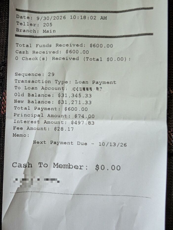 A printed bank receipt showing loan transaction details, serving as a found paper object