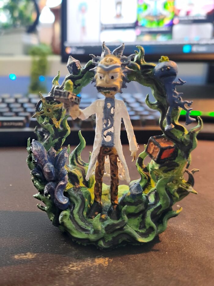 A hand-painted 3D print of Rick Sanchez surrounded by swirling green portal energy.