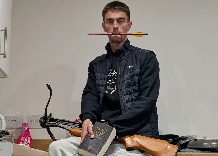 First picture of man fatally mauled by tiger holding a Bible and crossbow with an arrow in his mouth. First picture of man fatally mauled by tiger holding a Bible and crossbow with an arrow in his mouth.
