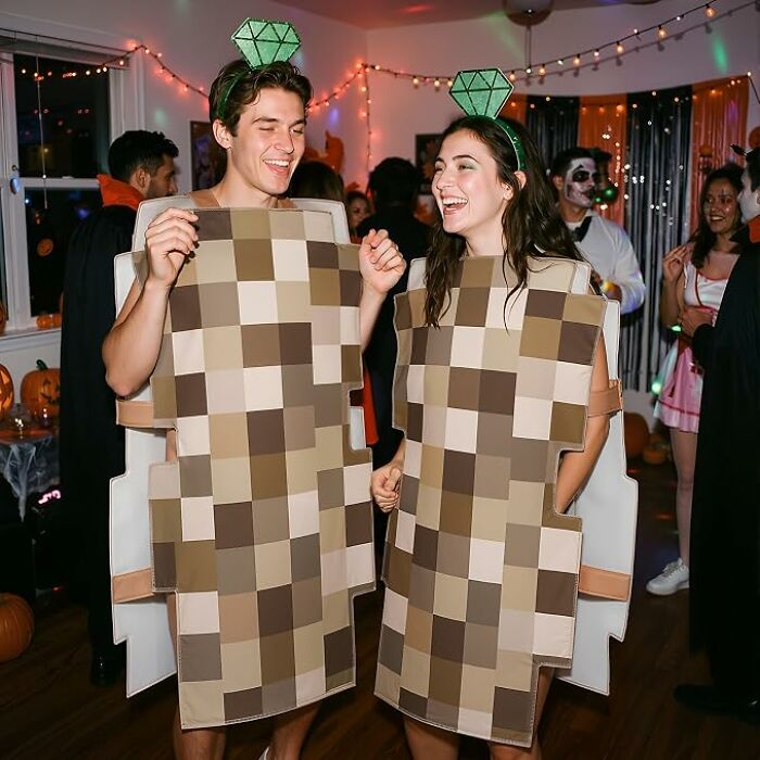 A couple dressed in pixelated censorship suits for creative and low-effort Halloween costumes.