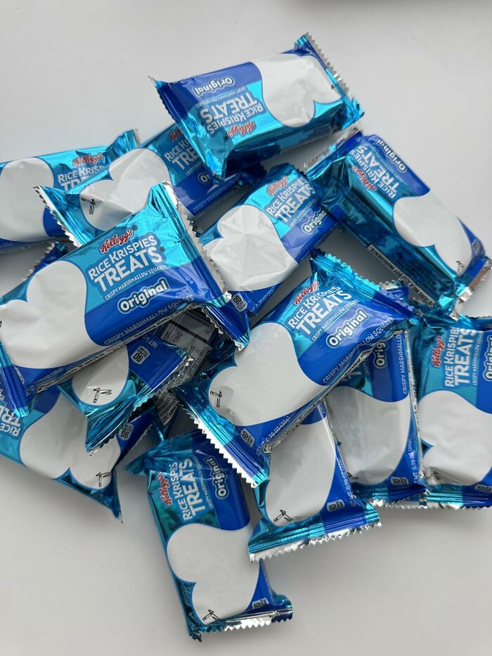 A pile of individually wrapped Rice Krispies Treats in blue packaging, popular Halloween Candies