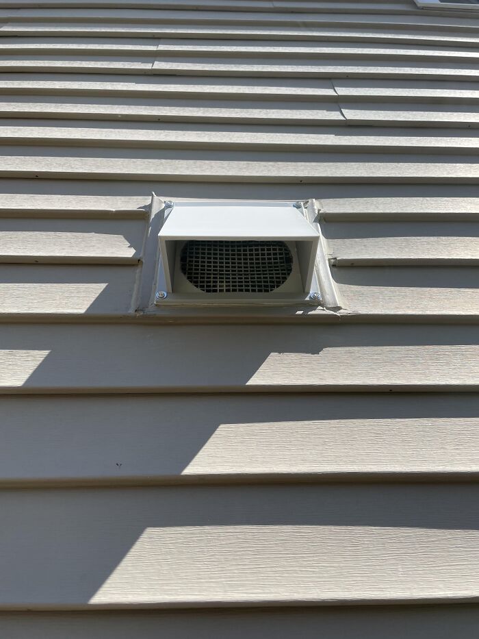 A sturdy custom outdoor wall vent cover made from white 3D prints.