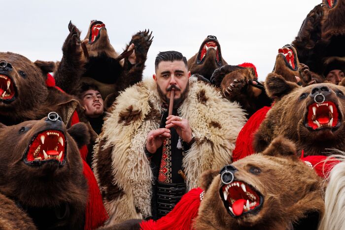 Man dressed in traditional fur with bear costumes during cultural festival