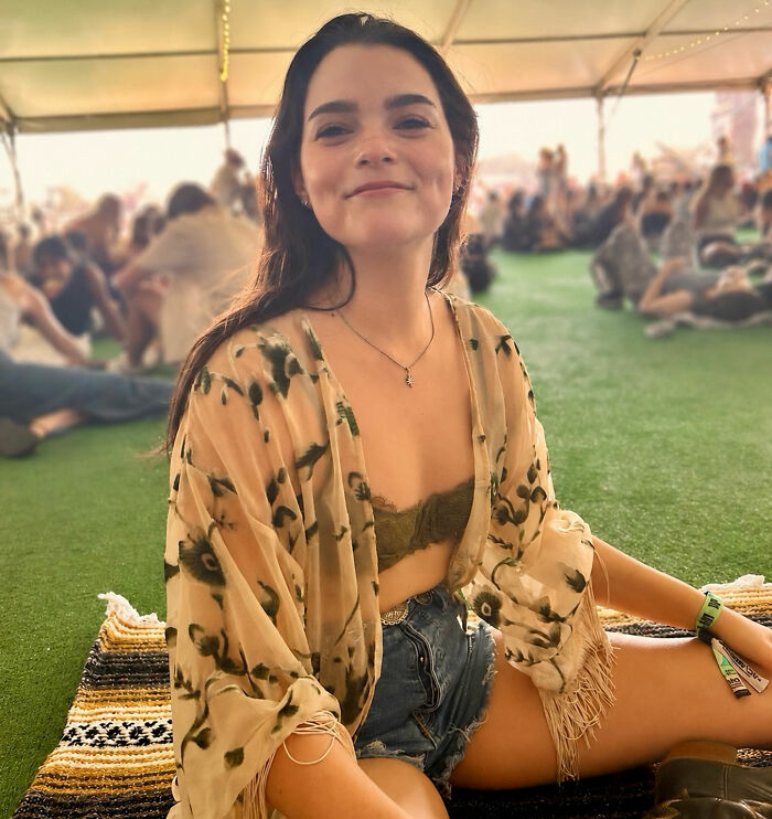 Hollywood star's real-life appearance smiling at an outdoor festival Hollywood star's real-life appearance smiling at an outdoor festival