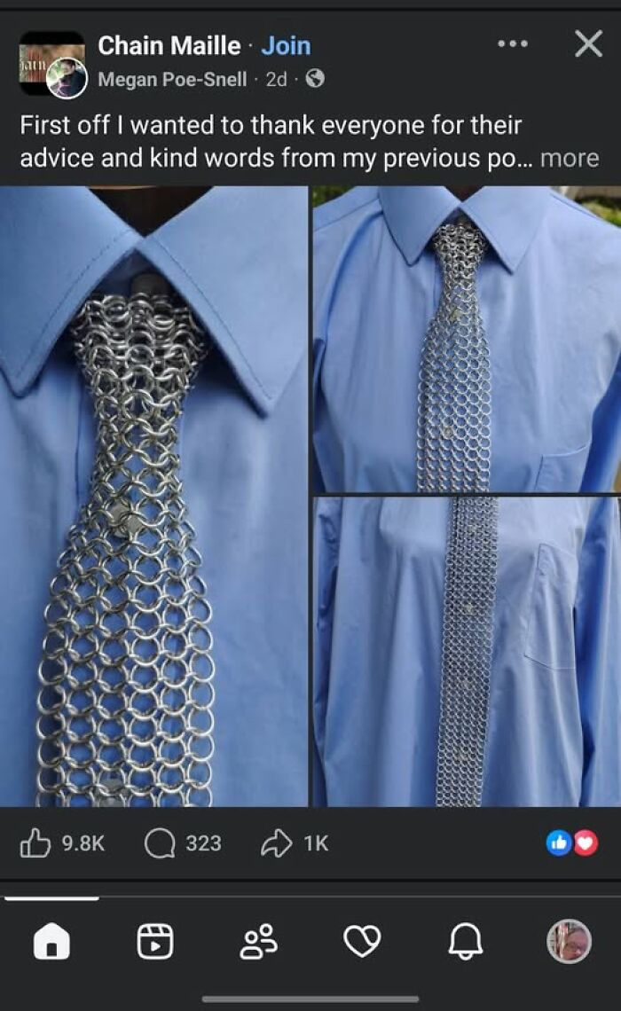 A tie made of silver metal chainmail worn over a blue shirt, showcasing creative crafts and art projects