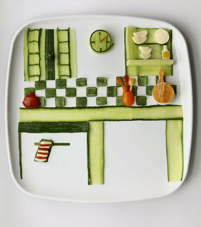 A miniature kitchen scene made from cucumber slices, showing everyday food turned into playful works of art