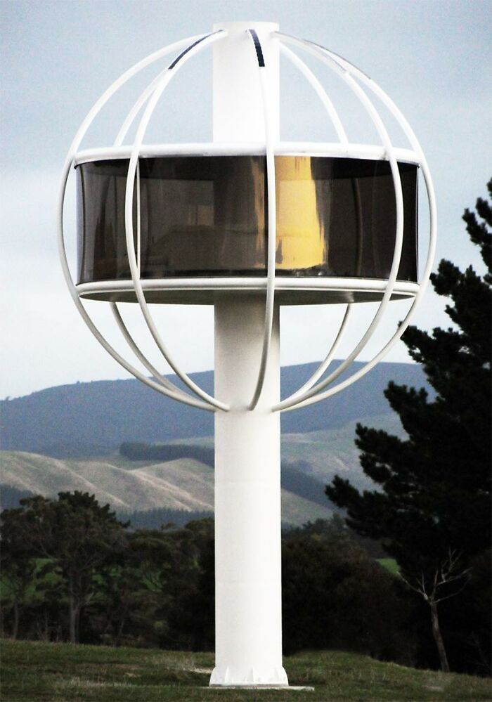 Futuristic spherical building supported by a single column in nature
