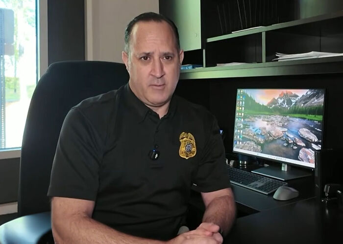 A police officer sitting at his desk, related to the investigation of a vet employee accused of taking a dog home. A police officer sitting at his desk, related to the investigation of a vet employee accused of taking a dog home.
