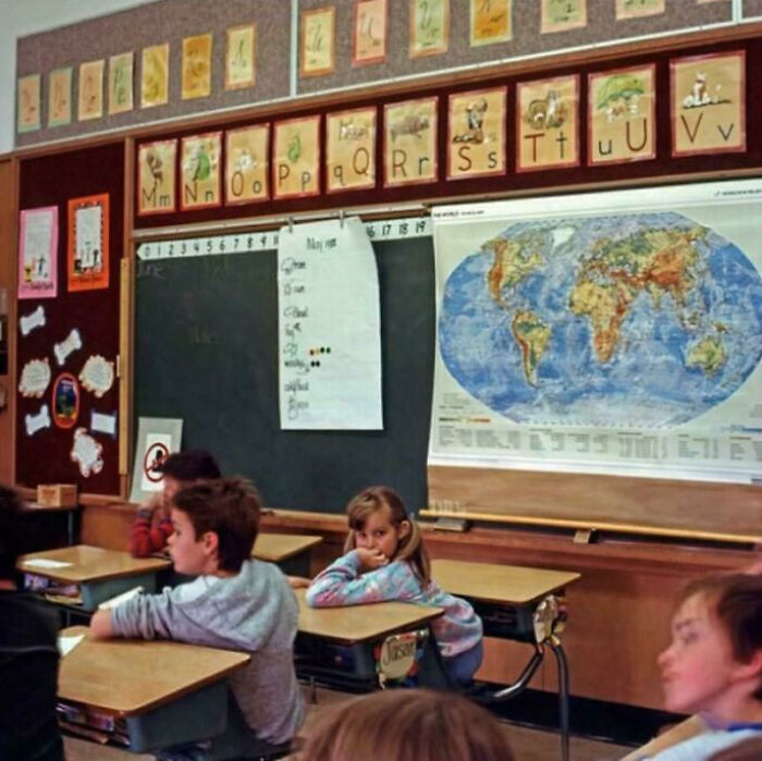 Vintage classroom scene with kids and educational posters evoking nostalgia