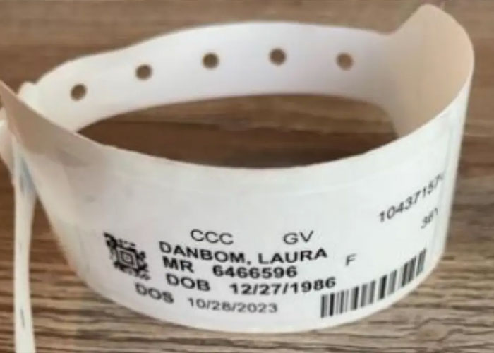 Hospital identification band for female employee showing medical record details related to alleged Amazon exec crime