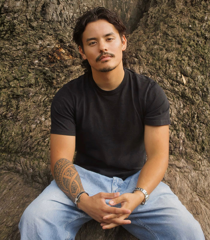 Collin Gosselin, son of Jon Gosselin and Kate Gosselin, sitting outside in a black t-shirt and jeans Collin Gosselin, son of Jon Gosselin and Kate Gosselin, sitting outside in a black t-shirt and jeans