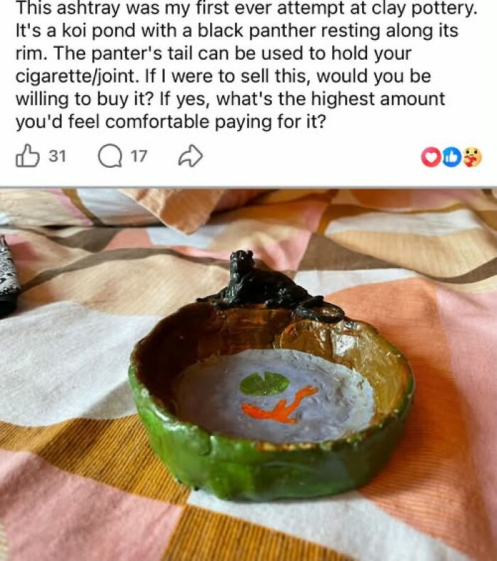A handmade clay ashtray styled like a koi pond with a panther, featuring crafts and art projects