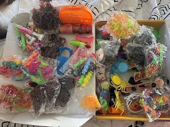 Collection of Halloween toys and trinkets in plastic packaging for non candy Halloween treats