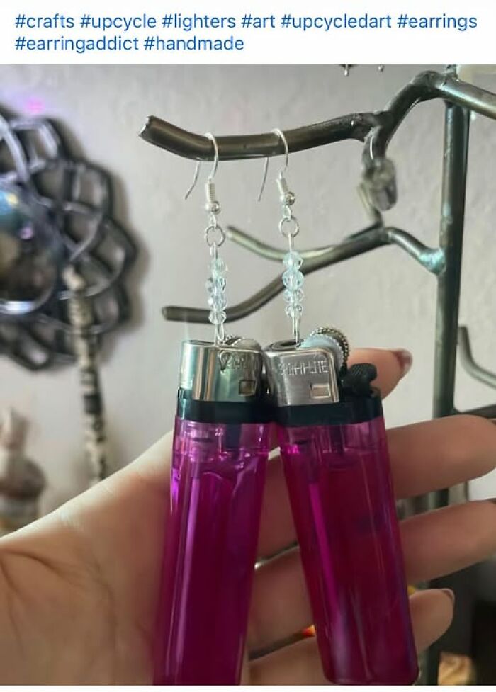 A hand holding up earrings made from pink lighters, showing hilariously bad crafts and art projects.