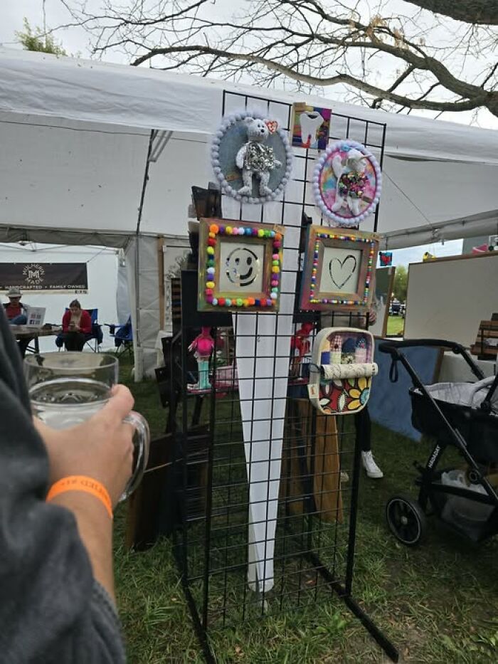 A display of bizarre crafts and art projects at an outdoor market booth