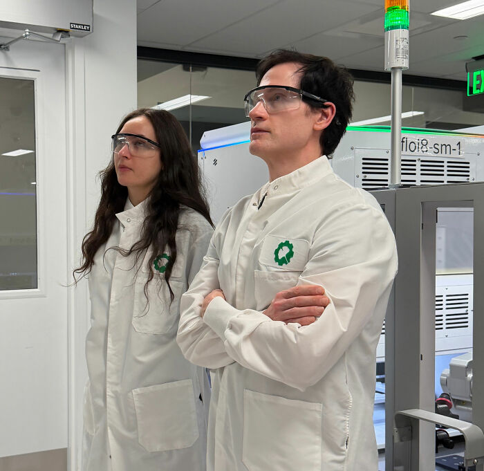 Biohacker Bryan Johnson and his girlfriend in lab coats discussing research related to a female health issue Biohacker Bryan Johnson and his girlfriend in lab coats discussing research related to a female health issue