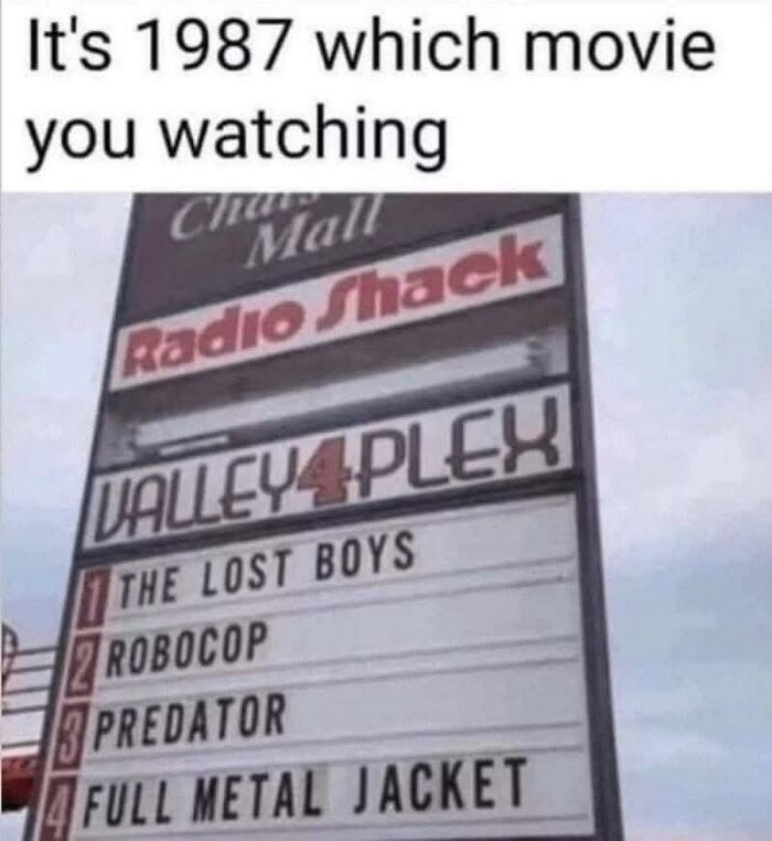 Movie theater sign from 1987 listing 80s classic films, featured in nostalgic photos.