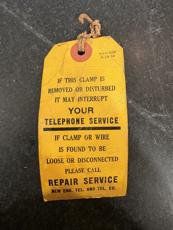 A vintage yellow paper tag with a warning message found paper.