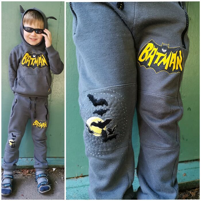 A young boy wearing a patched Batman hoodie and pants, demonstrating how creativity can save money.