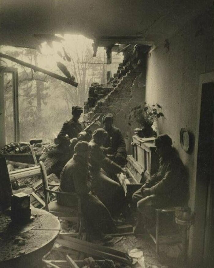Russian Soldiers Playing Piano In A Wrecked Living Room In Berlin, 1945