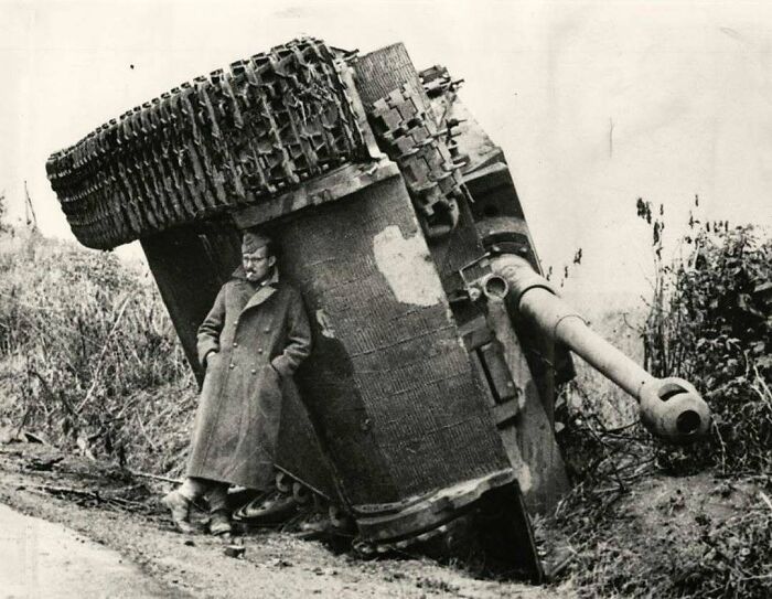 A British Soldier Hiding From The Rain Under An Overturned Tiger Tank. Italy, 1944