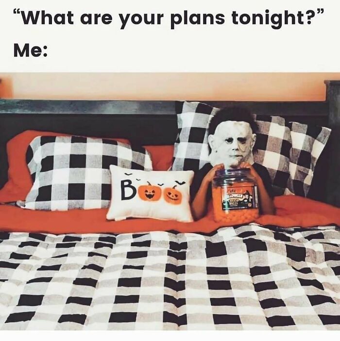 Spooky season memes showing a person in a Michael Myers mask in bed with snacks