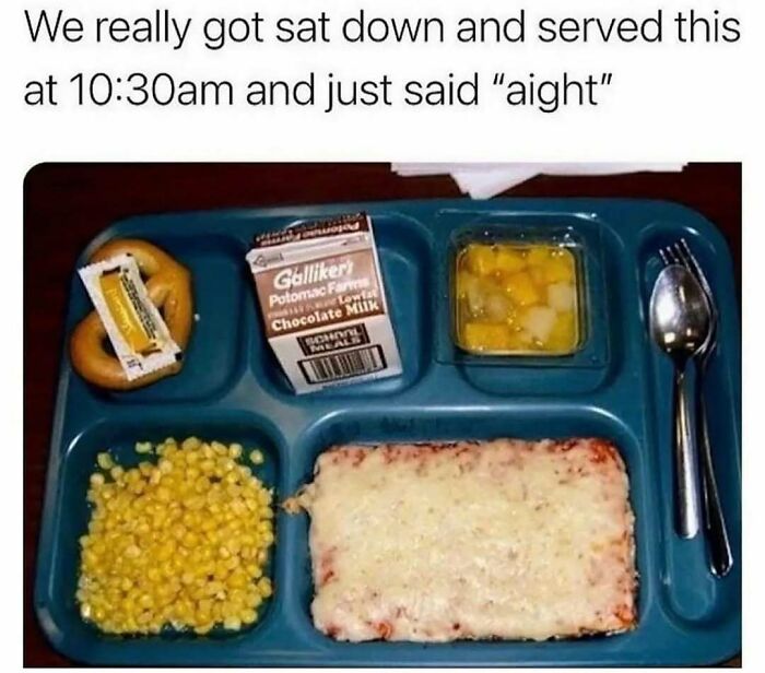 A nostalgic school lunch tray with square pizza and chocolate milk
