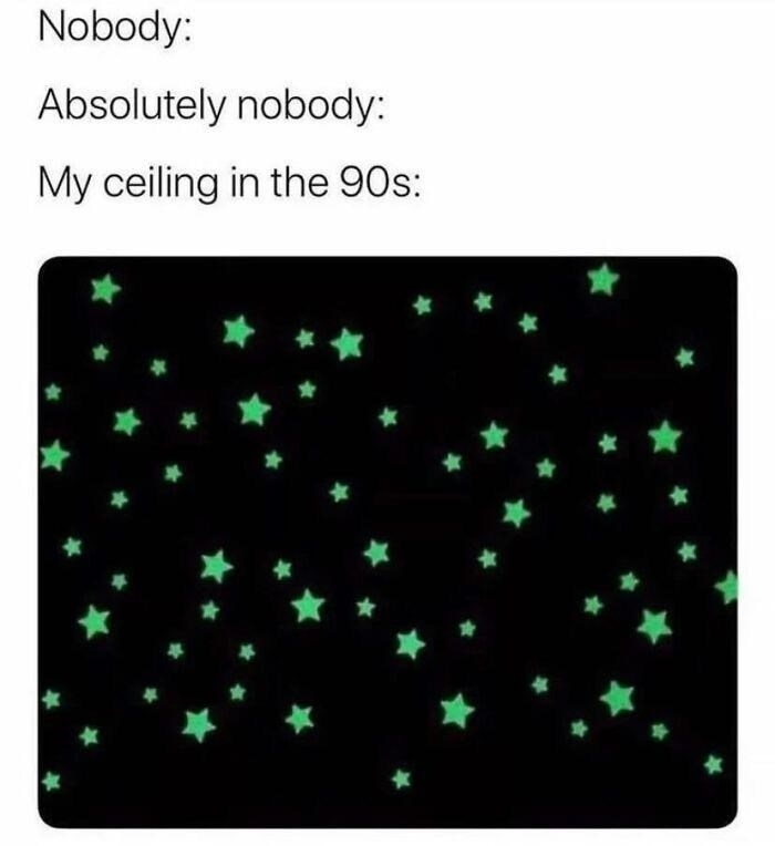Glow-in-the-dark stars on a dark ceiling evoking nostalgic memories of the 90s bedroom