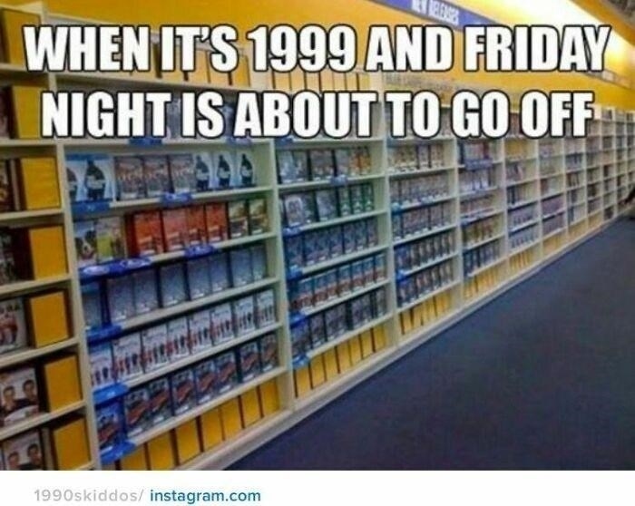 Nostalgic image of fully stocked VHS shelves at Blockbuster video store in 1999