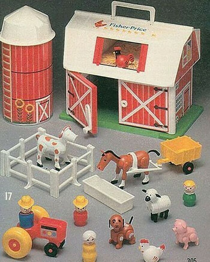 A nostalgic vintage Fisher-Price Little People farm set with barn, silo, and animals.