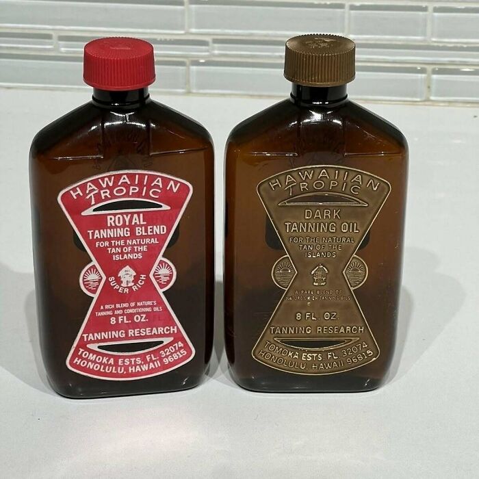 Vintage Hawaiian Tropic Royal Tanning Blend and Dark Tanning Oil bottles showing nostalgic summer memories