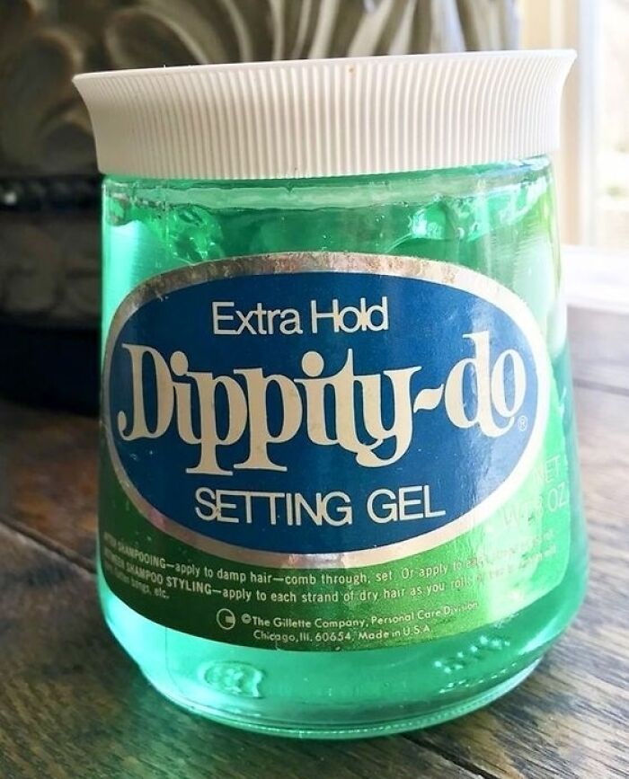 A vintage jar of green Dippity-do extra hold setting gel, a nostalgic hair care product.