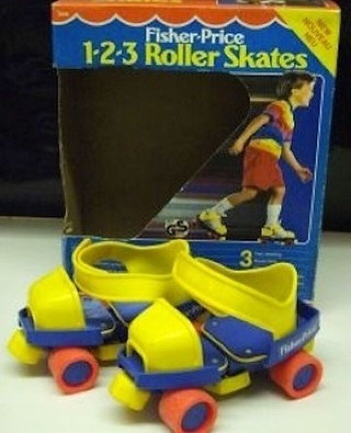 Nostalgic yellow and blue Fisher-Price roller skates in their original vintage packaging