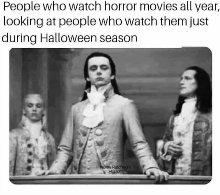 Spooky season meme of Twilight vampires looking superior about watching horror movies all year round