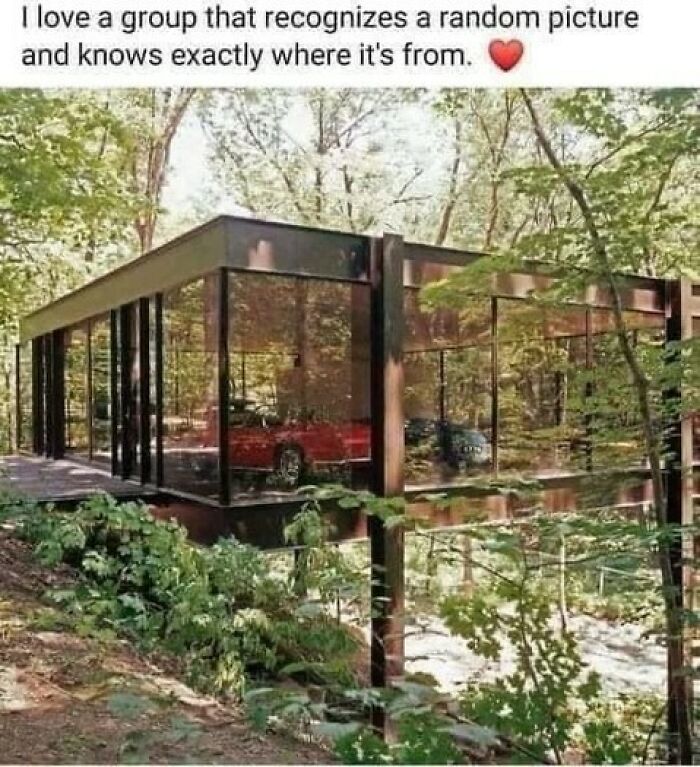 Nostalgic glass garage from the movie Ferris Bueller's Day Off with a red sports car inside.