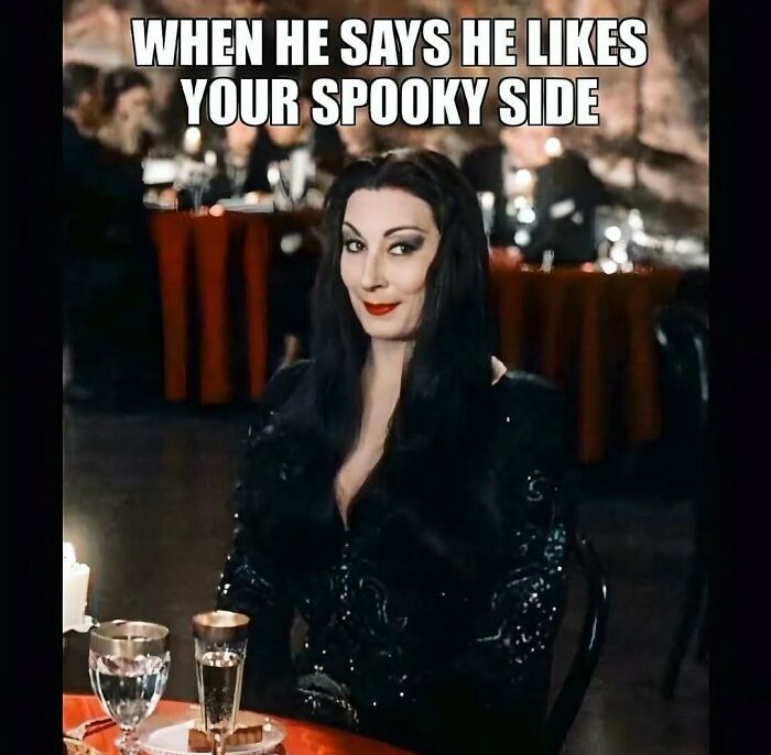 Spooky season meme showing Morticia Addams smiling about someone liking her dark side