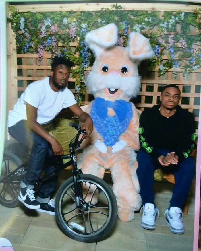 Hilarious pics of two young men posing awkwardly with a giant Easter Bunny mascot.