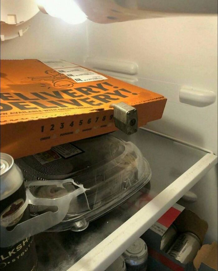 A locked pizza box inside a refrigerator, shared in hilarious pics.